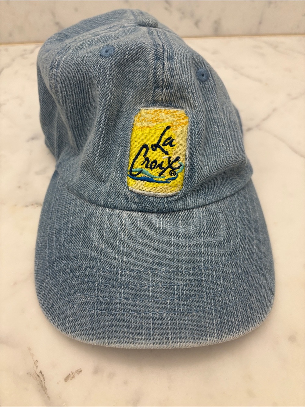 Light Blue Denim Baseball Cap with Yellow La Croix Patch